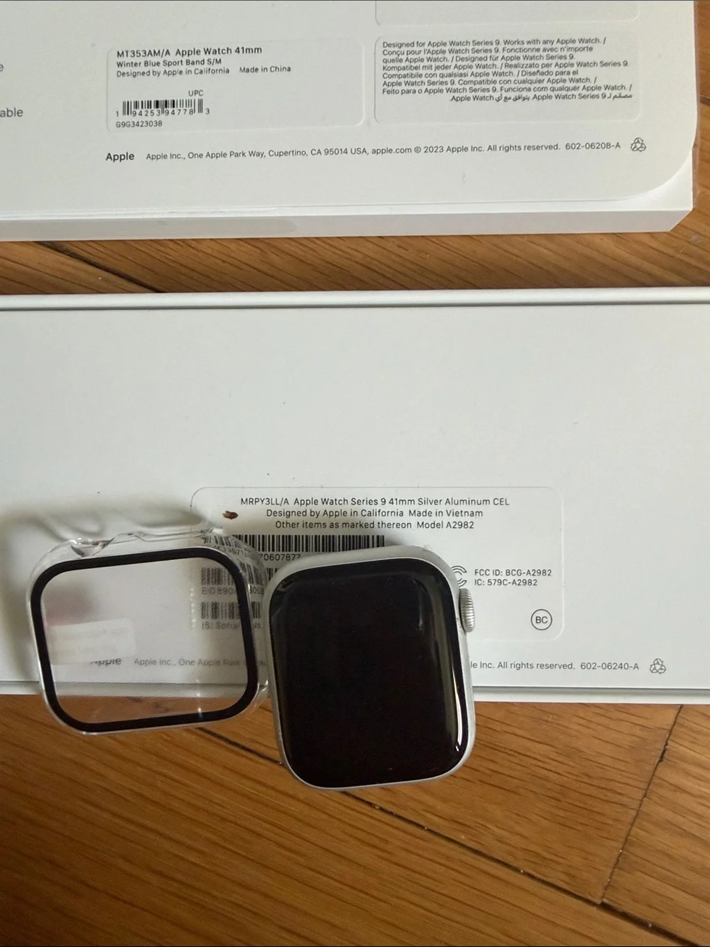 Apple Smartwatch with White, Pinkish-Beige, Tan, and Blue Bands